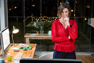 Businesswoman looking at computer screen in the office