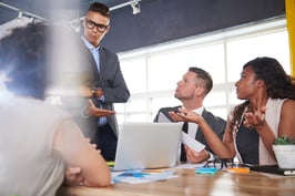 team of successful business people having a meeting in executive sunlit office-3